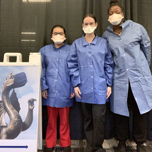 From left to right: Saznin Chowdhury, Talia DiBonaventura and Sarah Okwuoha are the three College of Nursing and Health Professions co-op students hired at the beginning of fall term to work at the student testing site.